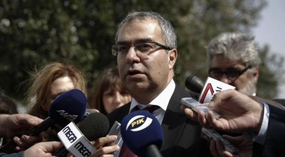 Cyprus Central Bank Governor Panicos Demetriades makes statements outside the parliament in Nicosia