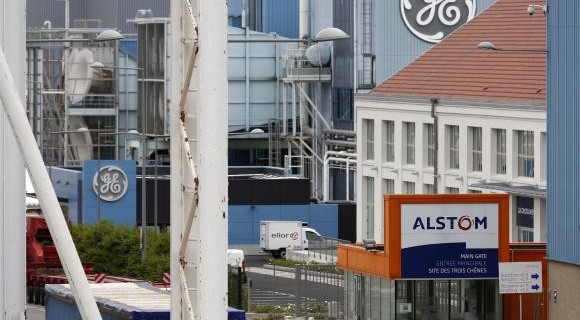 The logos of French power and transport engineering company Alstom and US conglomerate General Electric are pictured on their site in Belfort