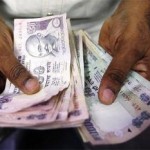 Rupee slips against US dollar