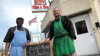 Slabbee's Ribs & Soul, stand in front of their recently opened take-out rib joint in Detroit, Michigan April 17, 2013.