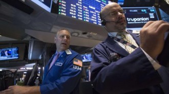 Specialist trader Geoffrey Friedman gives a price just after the opening bell on the floor of the New York Stock Exchange