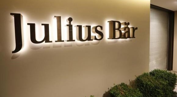 The company logo is placed beside the entrance of the headquarters of Swiss bank Julius Baer in Zurich