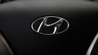 Logo of Hyundai Motor is seen on the steering wheel of a car at a Hyundai dealership in Seoul