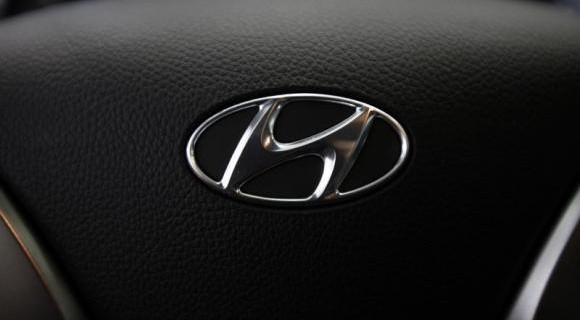 Logo of Hyundai Motor is seen on the steering wheel of a car at a Hyundai dealership in Seoul