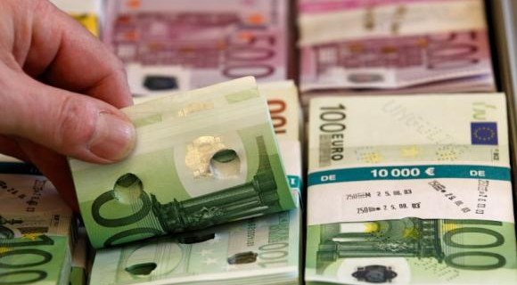 Punctured euro banknotes used for training purposes are presented during news conference on German custom's annual statistics in Berlin