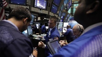 Traders work on the floor of the New York Stock Exchange