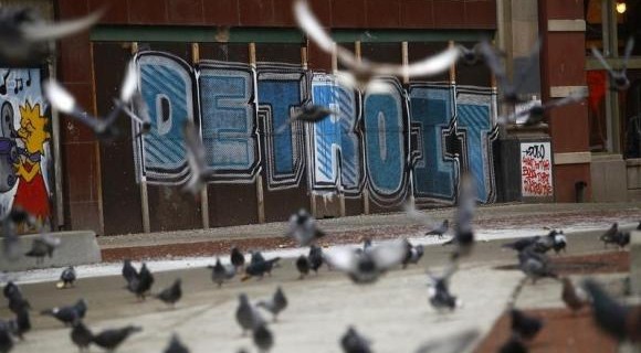 Pigeons are seen near graffiti in Detroit