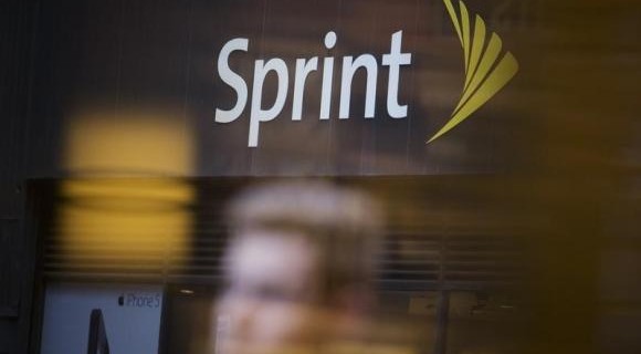 People walk past a Sprint store in New York