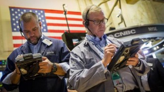 Traders work on the floor of the New York Stock Exchange