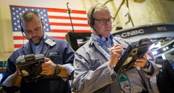 Traders work on the floor of the New York Stock Exchange