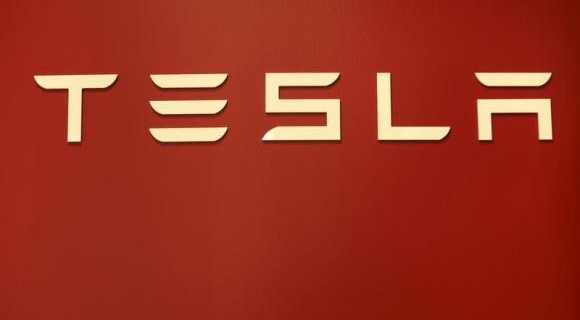 A Tesla Motors logo is shown at a Tesla Motors dealership at Corte Madera Village, an outdoor retail mall, in Corte Madera