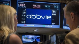 A screen displays the share price for pharmaceutical maker AbbVie on the floor of the New York Stock Exchange