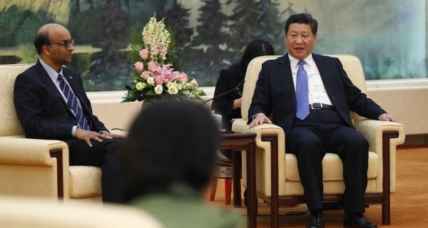 China's President Xi Jinping meets with the guests at the Asian Infrastructure Investment Bank launch ceremony at the Great Hall of the People in Beijing