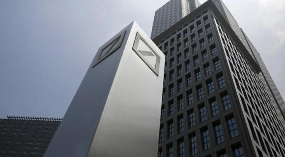 Logos of Deutsche Bank AG are seen in Tokyo