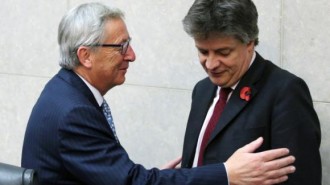 The European Commission's new President Juncker greets EU Commissioner  Hill during the first official meeting of the EU's executive body in Brussels