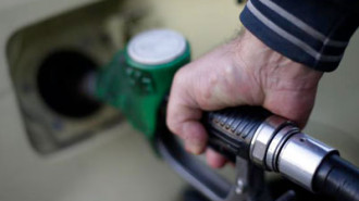 oil - petrol - A man fills up his car