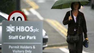 A worker leaves HBOS offices in Edinburgh, Scotland