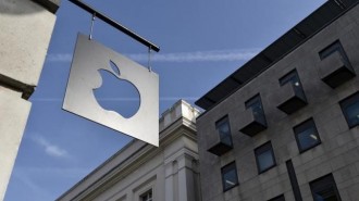 A sign is seen outside the Apple Store in Covent Garden in London