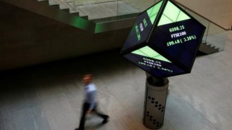 A man walks through the lobby of the London Stock Exchange in London