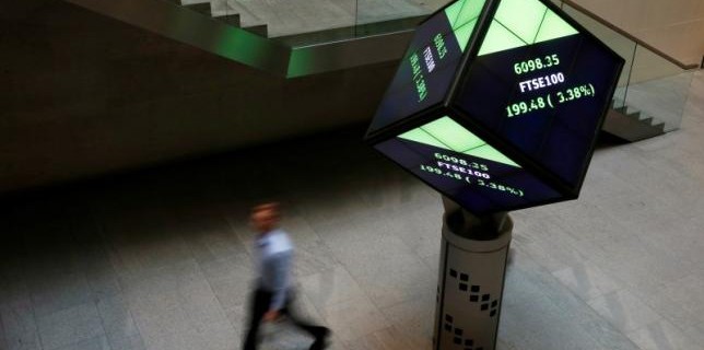 A man walks through the lobby of the London Stock Exchange in London