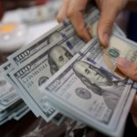 Dollar stands tall as Fed minutes rekindle June rate hike bets