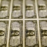 Dollar edges up, but on track for weekly loss