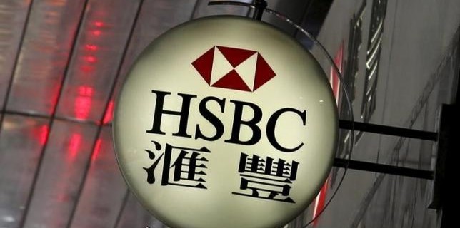 A logo of HSBC is displayed outside a branch in the financial district in Hong Kong