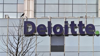 The Deloitte Company logo is seen on a commercial tower at Gurgaon, on the outskirts of New Delhi