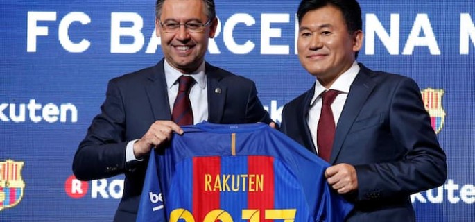 FC Barcelona's President Josep Maria Bartomeu and Rakuten's President and CEO Hiroshi Mikitani pose with a jersey after signing a contract as main sponsor in Barcelona