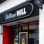 William Hill flags profits at top end of target range
