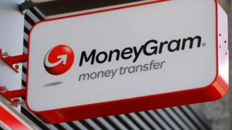 A Moneygram logo is seen outside a bank in Vienna