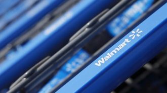 Shopping carts are seen outside a new Wal-Mart Express store in Chicago