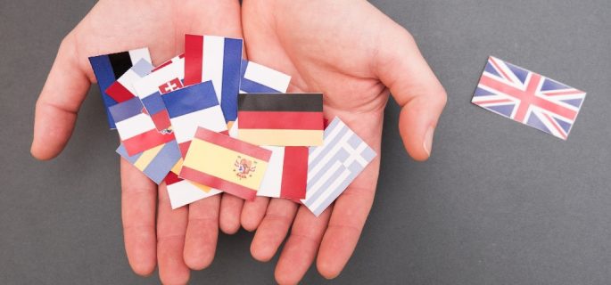 European flags and great britain flag on hands