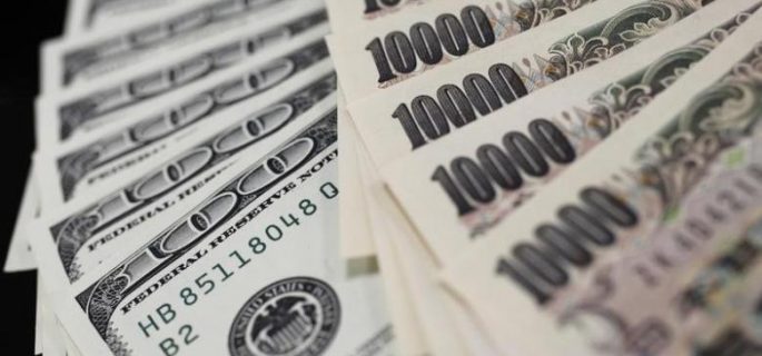 A picture illustration shows U.S. 100 dollar bank notes and Japanese 10,000 yen notes taken in Tokyo August 2, 2011. REUTERS/Yuriko Nakao